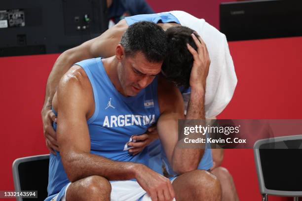 Luis Scola of Team Argentina is consoled by teammate Facundo Campazzo as time winds down in Argentina's loss to Australia in a Men's Basketball...