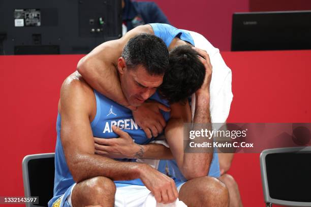 Luis Scola of Team Argentina is consoled by teammate Facundo Campazzo as time winds down in Argentina's loss to Australia in a Men's Basketball...