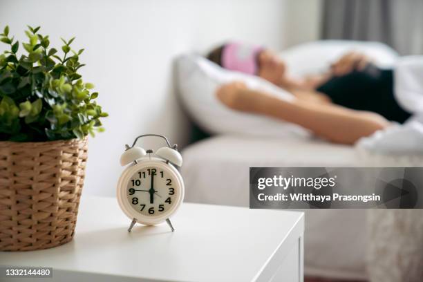 alarm clock - bedside table stock pictures, royalty-free photos & images