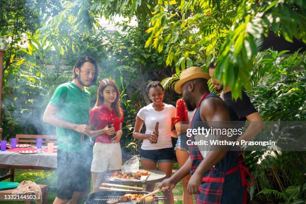 barbecue party. - asian person bbq stock pictures, royalty-free photos & images