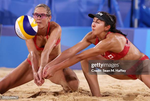 Sarah Pavan and Melissa Humana-Paredes of Team Canada compete against Team Australia during the Women's Quarterfinal beach volleyball on day eleven...