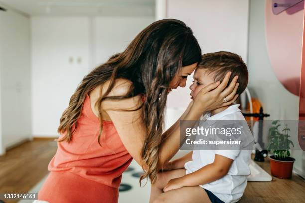 mom and son - sad mum stock pictures, royalty-free photos & images
