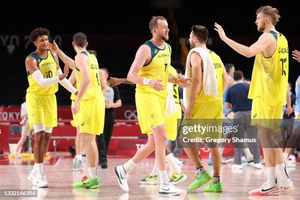 Joe Ingles of Team Australia high-fives teammate Jock Landale during the second half of a Men's Basketball Quarterfinal game against Team Argentina...