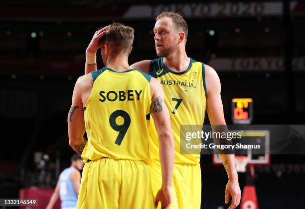 Joe Ingles of Team Australia pats teammate Nathan Sobey on the head during the second half of a Men's Basketball Quarterfinal game against Team...