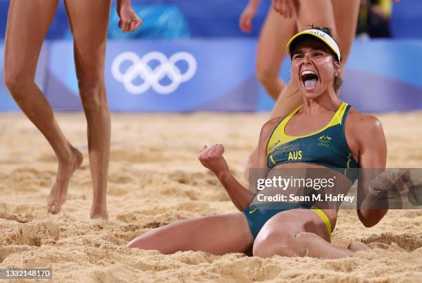 Mariafe Artacho del Solar of Team Australia reacts after defeating Team Canada during the Women's Quarterfinal beach volleyball on day eleven of the...