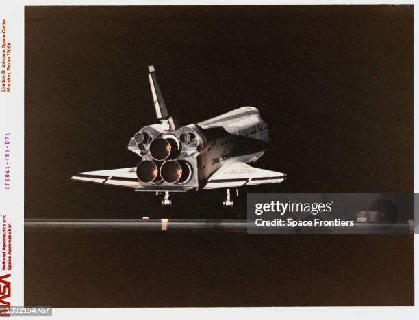 Rear view of the Space Shuttle Endeavour as it touches down on Shuttle Landing Facility Runway 33, the second night landing at KSC in the history of...