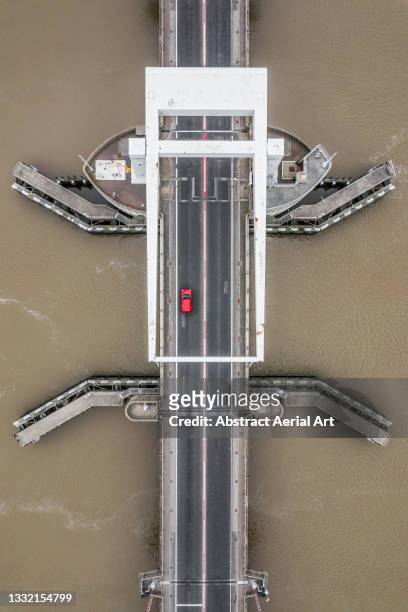 red car crossing breydon bridge over the river yare seen from directly above, great yarmouth, england, united kingdom - cross channel stock pictures, royalty-free photos & images