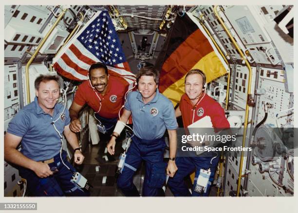 American NASA astronaut Jerry L Ross, American NASA astronaut Bernard A Harris Jr, German DFVLR astronaut Ulrich Walter, and German ESA astronaut...