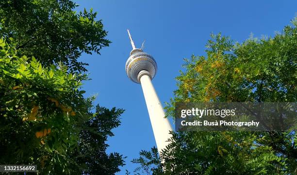 view from below of berlin tv tower (fernsehturm). berlin, germany - berlin fernsehturm stock pictures, royalty-free photos & images