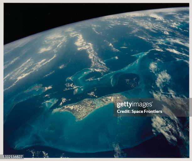 The light blue shallow water platforms of the Bahamas, separated by very deep dark blue channels, with Andros Island and the Tongue of the Ocean, the...