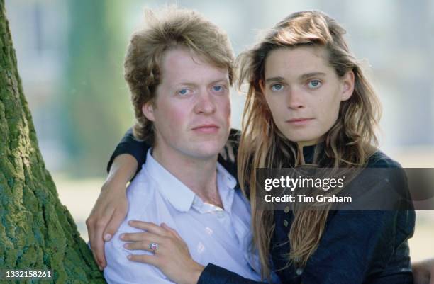 Viscount Althorp, Charles Spencer, and his fiancee, British model Victoria Lockwood, sit beneath a tree in the grounds of the Spencer family home,...