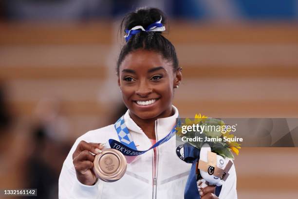 Simone Biles of Team United States poses with the bronze medal during the Women's Balance Beam Final medal ceremony on day eleven of the Tokyo 2020...
