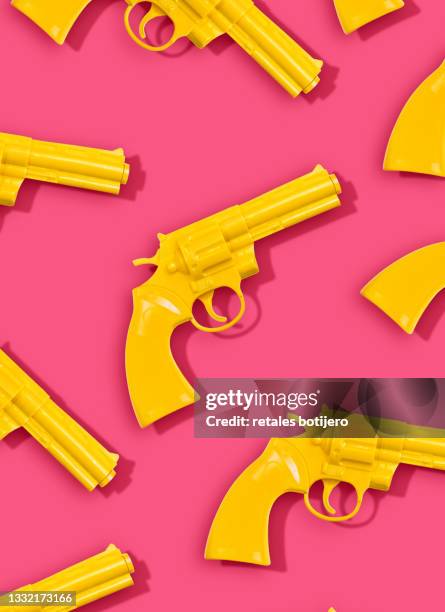 plastic yellow toy guns - toy gun stock pictures, royalty-free photos & images