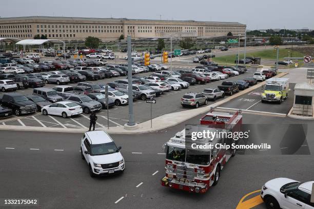 Emergency first responder vehicles depart the scene of a shooting with multiple victims at a mass transit station outside the Pentagon on August 03,...