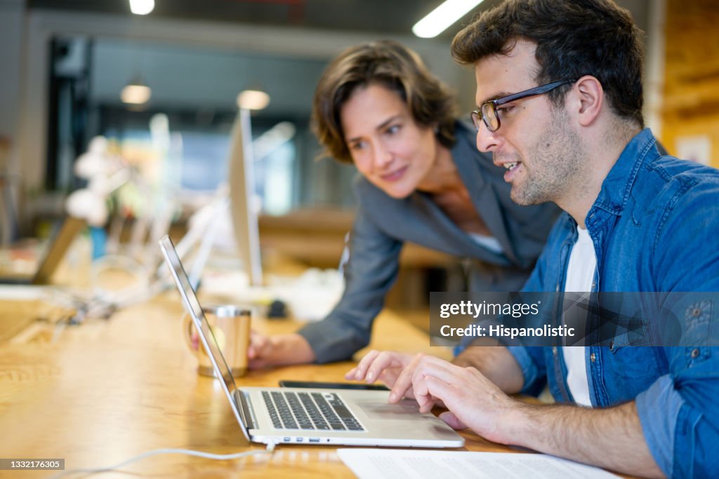 Coworkers sharing ideas at a creative office