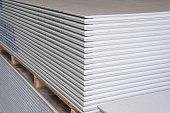 The stack of WHITE Standard Gypsum board panel. Plasterboard. Panel Type