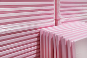 Pink Extruded Polystyrene XPS foam thermal insulation boards  stacked in construction site. High Density, water absorption. Eco energy saving  technology