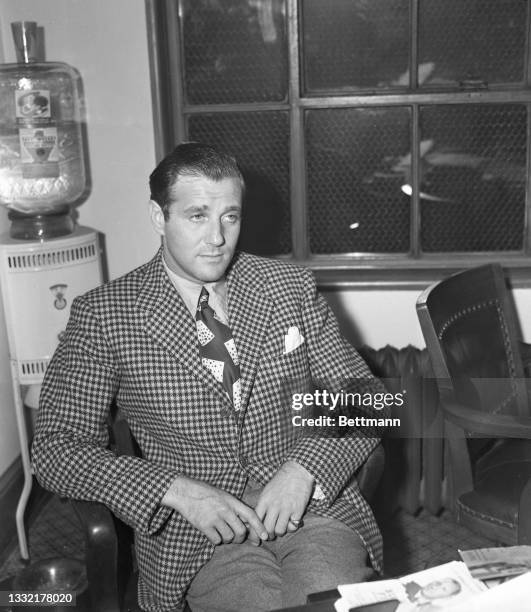 Los Angeles, CA: Benny Siegel, Hollywood night life figure, is shown after being taken from his luxurious Holmby Hills home for questioning in Los...