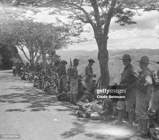 Members of the 65th Infantry prepare for battle near the beach at Luquillo. Nearly ten thousand Puerto Ricans were called into service in the first...