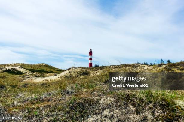 coastal landscape withamrum lighthouse in background - amrum stock-fotos und bilder