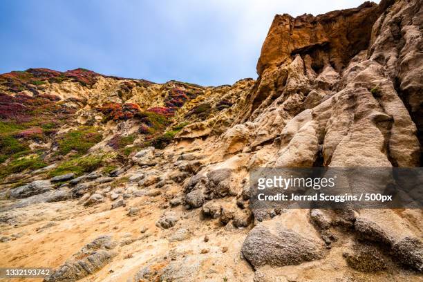 low angle view of rock formation against sky,bodega bay,california,united states,usa - sonoma desert stock-fotos und bilder