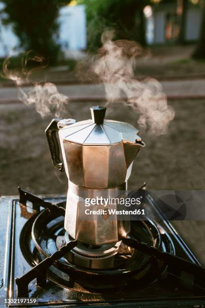 coffee pot on stove at campsite - moka foto e immagini stock