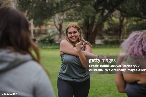 young women exercising in nature - aboriginal woman stock-fotos und bilder