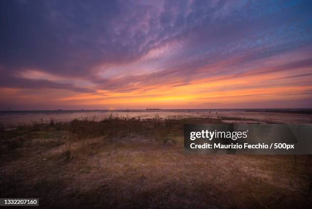 scenic view of sea against sky during sunset,chioggia,venice,italy - maurizio fecchio fotografías e imágenes de stock