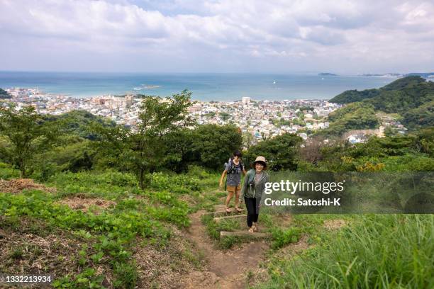 japanese women hiking on mountain, pacific ocean is at the background - zushi kanagawa bildbanksfoton och bilder