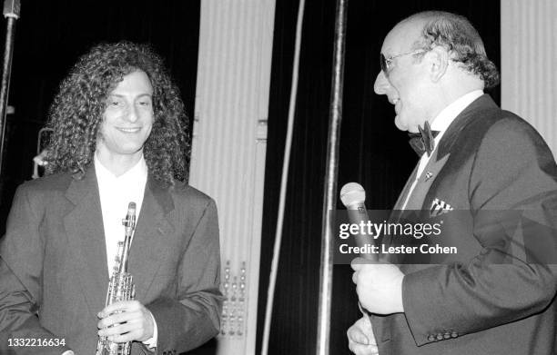 American smooth jazz saxophonist Kenny G and American record producer, A&R executive, music industry executive, and lawyer Clive Davis attend the...