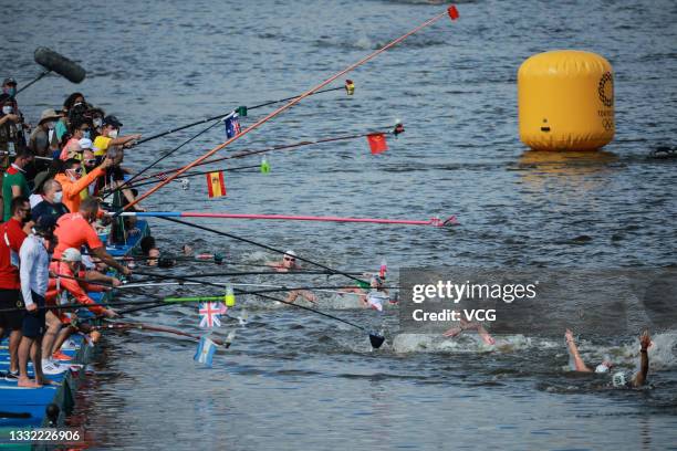Athletes compete in the Women's 10 km Marathon Swimming on day twelve of the Tokyo 2020 Olympic Games at Odaiba Marine Park on August 04, 2021 in...