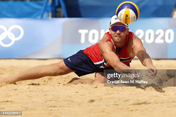 Christian Sandlie Sorum of Team Norway dives for the ball against Team ROC during the Men's Quarterfinal beach volleyball on day twelve of the Tokyo...