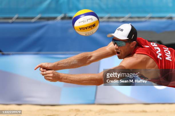 Anders Berntsen Mol of Team Norway dives for the ball against Team ROC during the Men's Quarterfinal beach volleyball on day twelve of the Tokyo 2020...