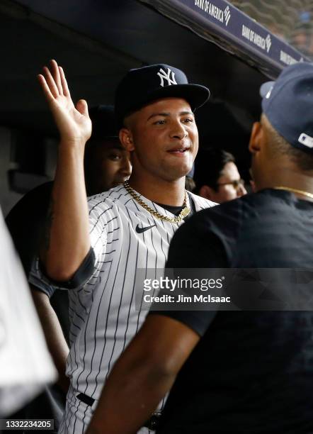 Luis Gil of the New York Yankees is congratulated in the dugout by his teammates after the sixth inning against the Baltimore Orioles at Yankee...