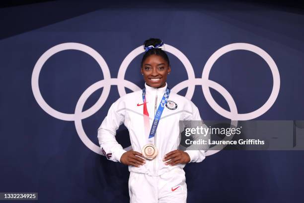 Simone Biles of Team United States poses with the bronze medal following the Women's Balance Beam Final on day eleven of the Tokyo 2020 Olympic Games...