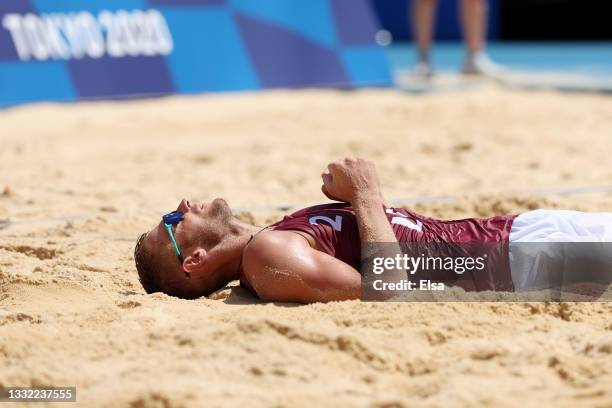 Edgars Tocs of Team Latvia celebrates after defeating Team Brazil during the Men's Quarterfinal beach volleyball on day twelve of the Tokyo 2020...