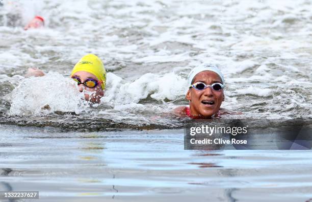 Ana Marcela Cunha of Team Brazil reacts after touching the finish line first in the Women's 10km Marathon Swimming on day twelve of the Tokyo 2020...