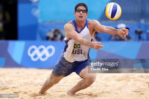 Alvaro Morais Filho of Team Brazil dives for the ball against Team Latvia during the Men's Quarterfinal beach volleyball on day twelve of the Tokyo...