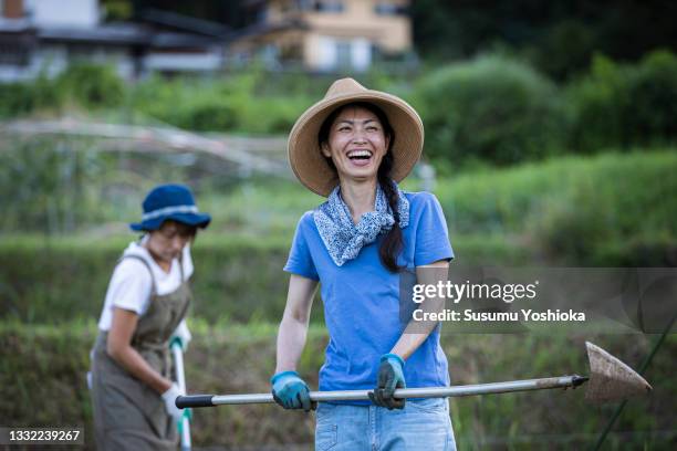 a group working on a farm in a rural environment - self sufficiency stock pictures, royalty-free photos & images