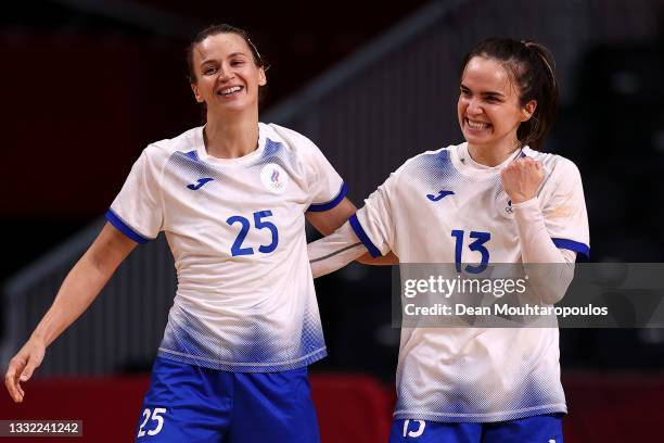 Anna Vyakhireva of Team ROC celebrates with teammate Olga Fomina after winning the Women's Quarterfinal handball match between Montenegro and ROC on...