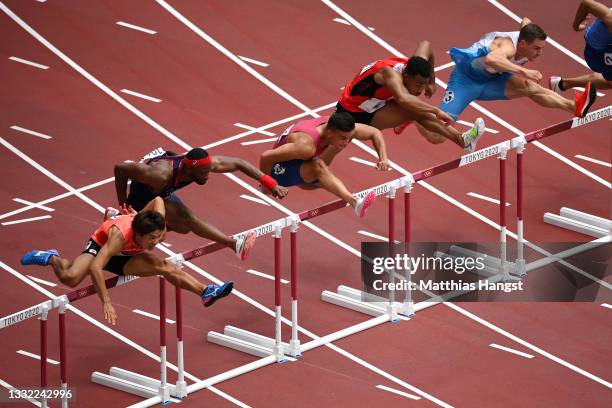 Devon Allen of Team United States finishes ahead of Aurel Manga of Team France in the Men's 110m Hurdles Semi-Final on day twelve of the Tokyo 2020...