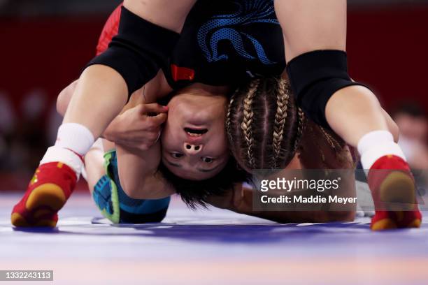 Helen Louise Maroulis of Team United States competes against Ningning Rong of Team China during the Women's Freestyle 57kg 1/8 Final on day twelve of...