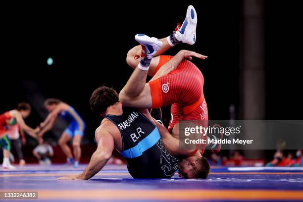 David Morris Taylor III of Team United States competes against Ali Shabanau of Team Belarus during the Men's Freestyle 86kg 1/8 Final on day twelve...