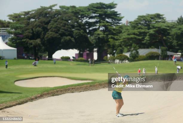 Hannah Green of Team Australia plays a shot from a bunker on the ninth hole during the first round of the Women's Individual Stroke Play on day...