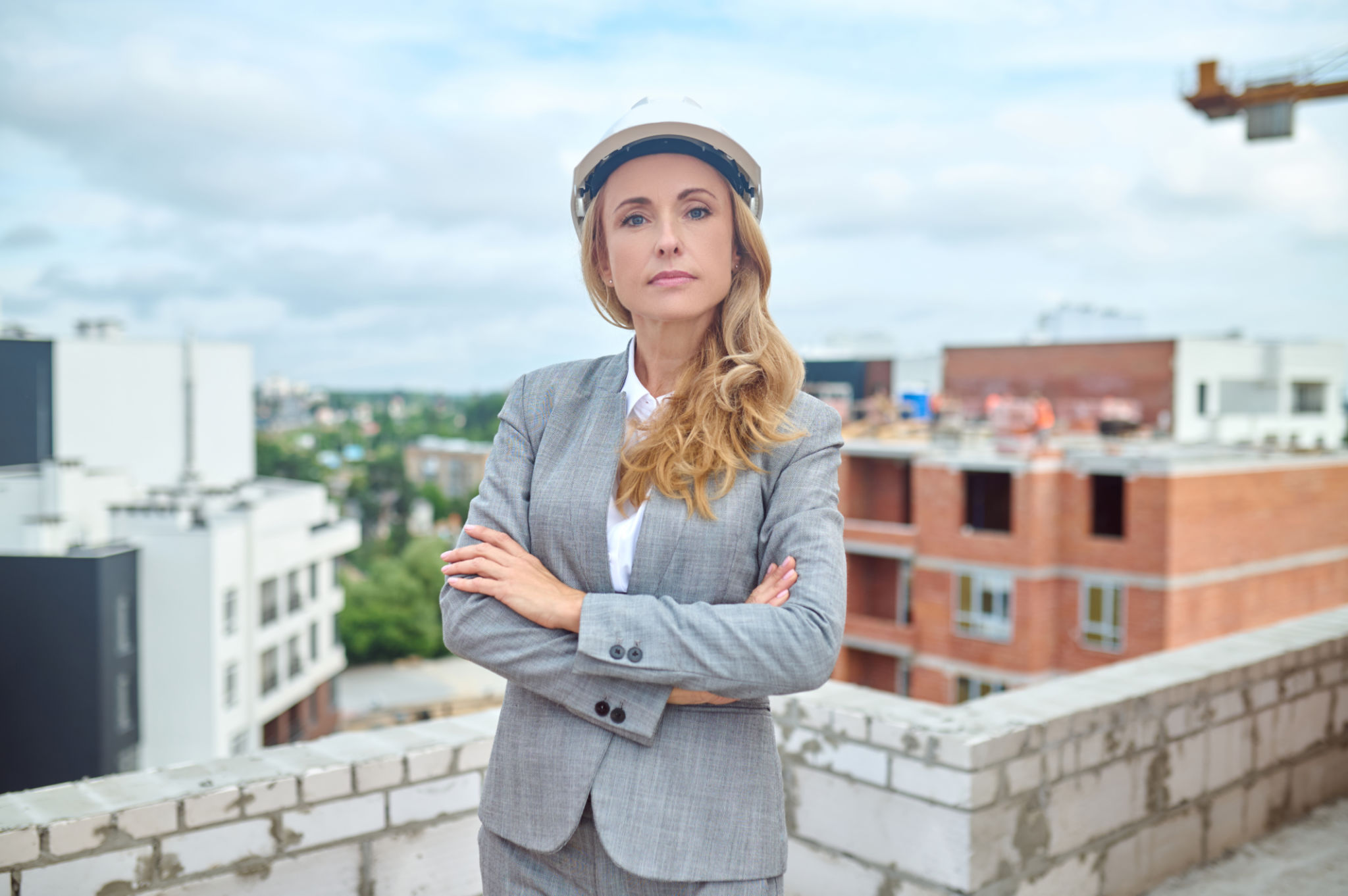 Serene confident supervisor with her arms crossed looking ahead Serene confident supervisor with her arms crossed looking ahead