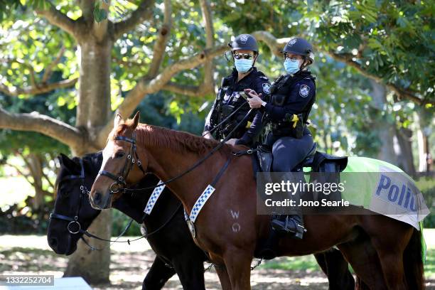 Mounted police patrol the botanic gardens on August 04, 2021 in Brisbane, Australia. Queensland is experiencing its biggest outbreak of the Covid-19...