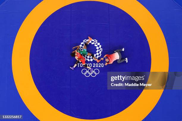 Anastasia Nichita of Team Moldova competes against Odunayo Folasade Adekuoroye of Team Nigeria during the Women's Freestyle 57kg 1/8 Final on day...