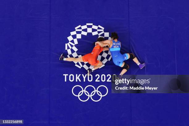 Evelina Georgieva Nikolova of Team Bulgaria competes against Anastasia Nichita of Team Moldova during the Women's Freestyle 57kg Quarter Final on day...