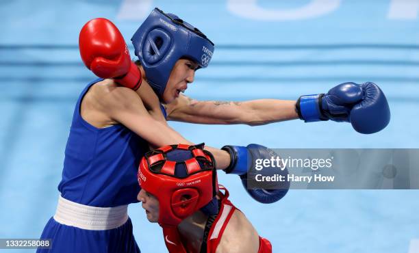 Buse Naz Cakiroglu of Team Turkey exchanges punches with Hsiao Wen Huang of Team Chinese Taipei during the Women's Fly semi final on day twelve of...