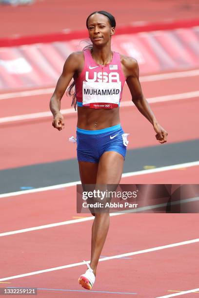 Dalilah Muhammad of Team United States crosses the finish line to win silver in the Women's 400m Hurdles Final on day twelve of the Tokyo 2020...